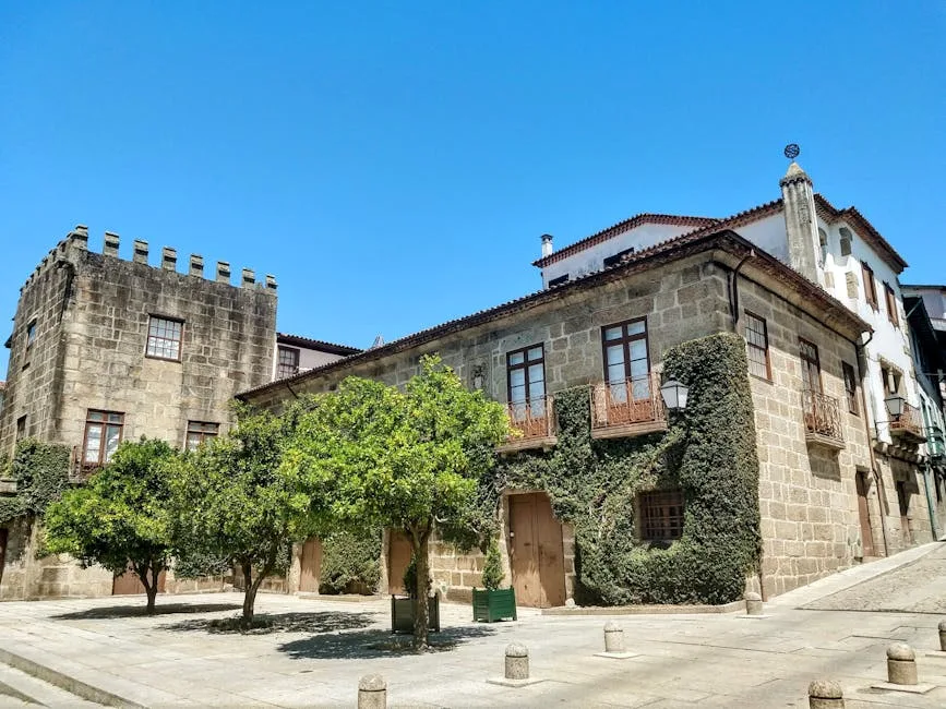 Explore medieval architecture in Guimarães, Portugal on a sunny day.